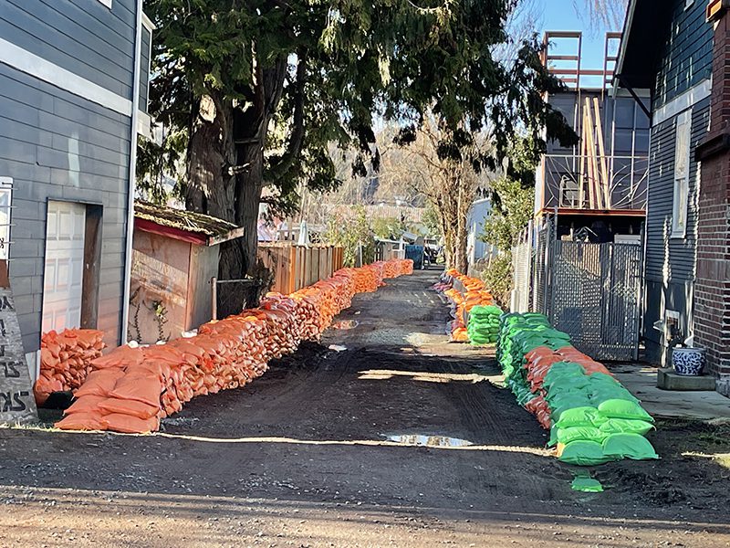 Hundreds of orange and green sandbags line an alley in South Park.