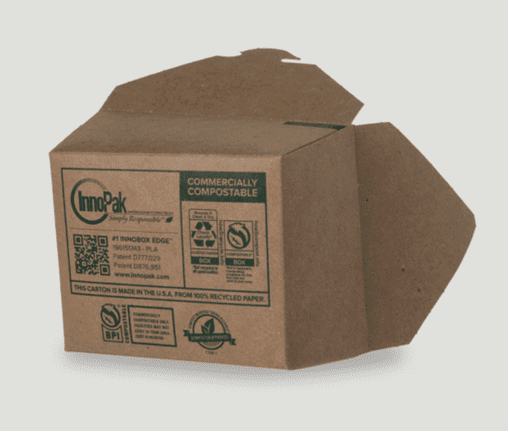 Brown, compostable take-out container that is lying on its side to show “Compostable Label” printed on the bottom of the container.