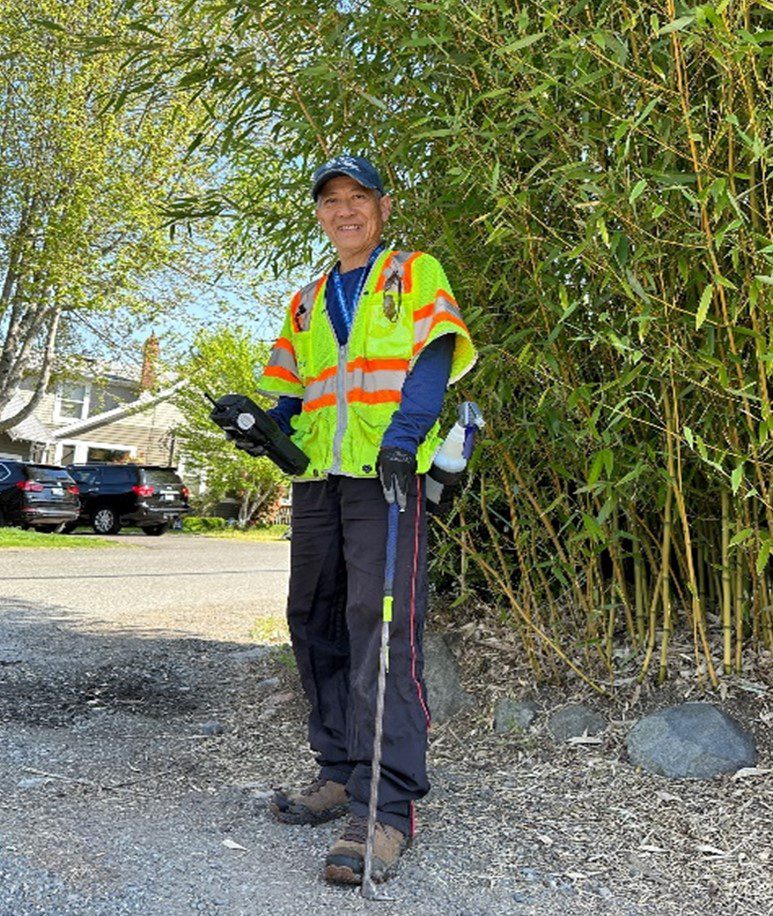 Image of smiling Phong Tang standing in a driveway.