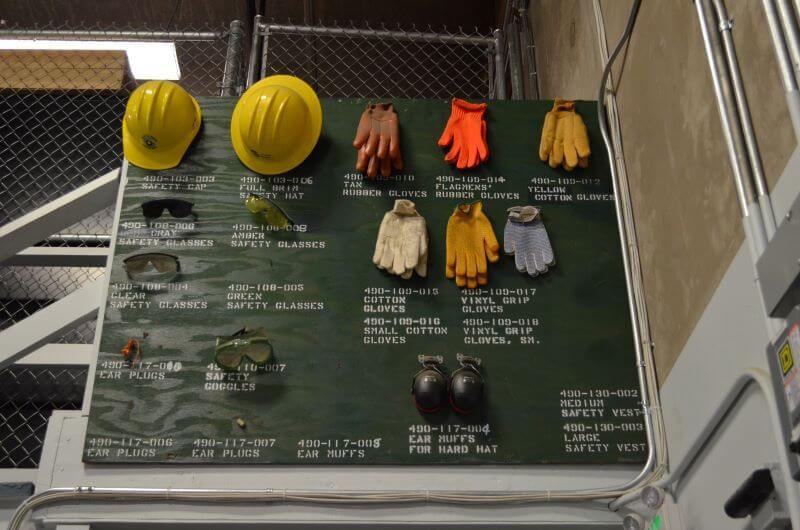 Board with examples of personal protective equipment.