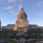 The Washington state capitol building and dome under a blue sky.