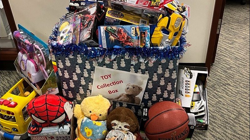 Toy donation box overflowing with toys.