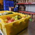 Produce in bins at a warehouse.