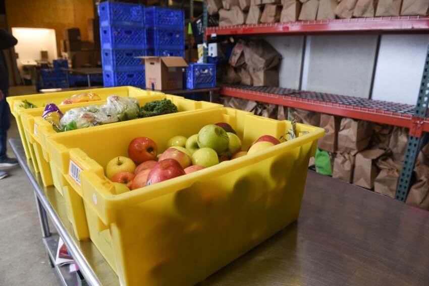 Produce in bins at a warehouse.